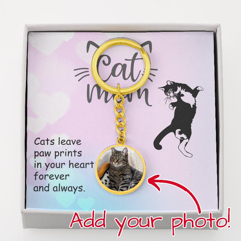 Keychain with a cat photo charm on a card with cat-themed text and graphics.