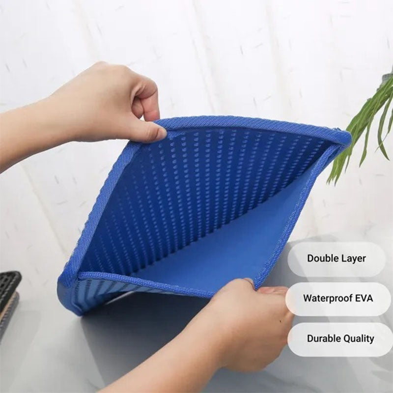 Blue cat litter trapper, two layers with hands holding it against a white background.