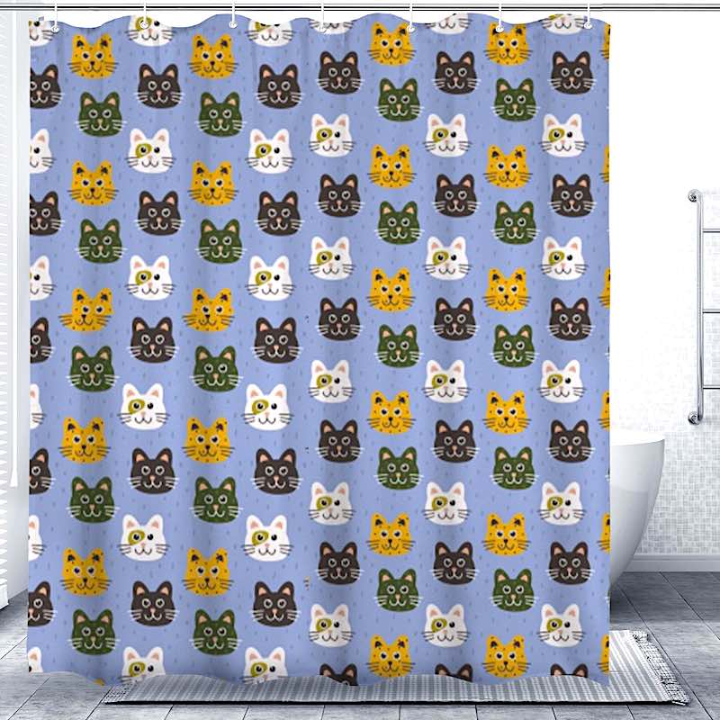 Blue shower curtain with a colorful cat pattern in a bathroom setting