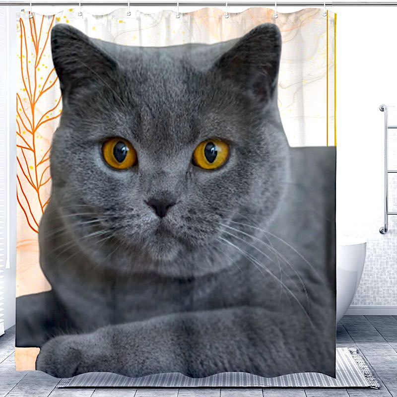 Shower curtain with a gray cat design in a bathroom setting