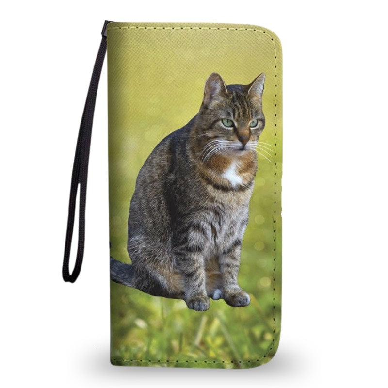 Green clutch purse featuring a custom cat photo with grass, on a white background