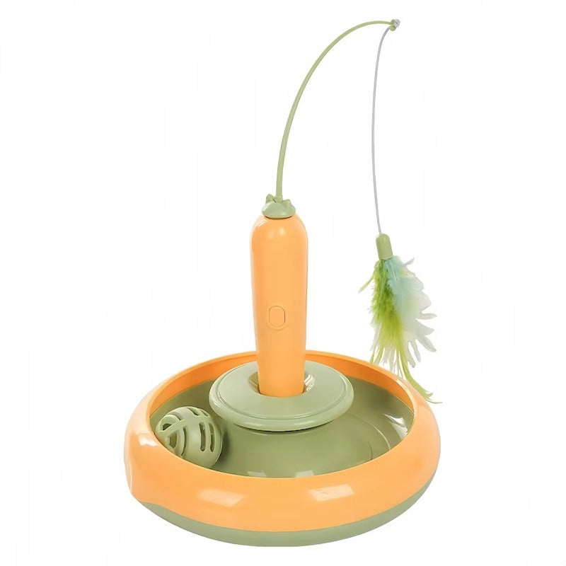 A pet toy set featuring a circular base in orange and sage green, a central orange handle with a curved green rod, and a feather wand with a green and white feather.