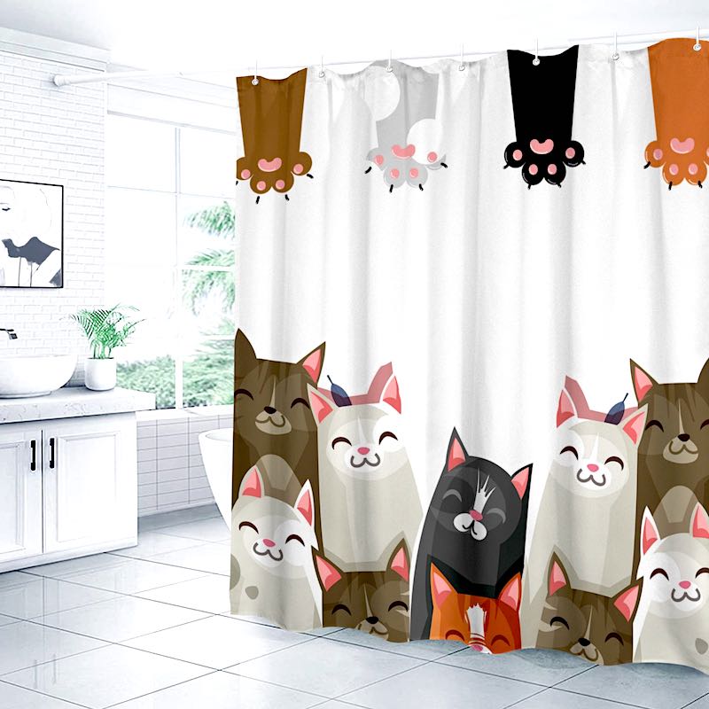Shower curtain with cartoon cat designs in a bathroom setting