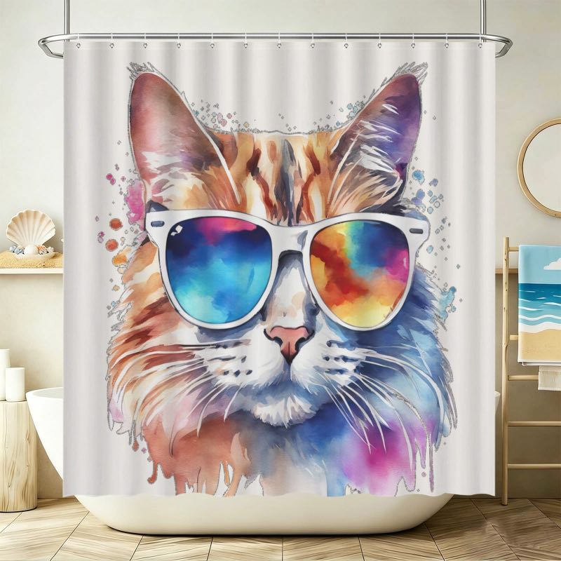 A white fabric shower curtain hanging in a bathroom, printed with a colorful watercolor-style cat face wearing white sunglasses with blue, pink, and orange reflective lenses.