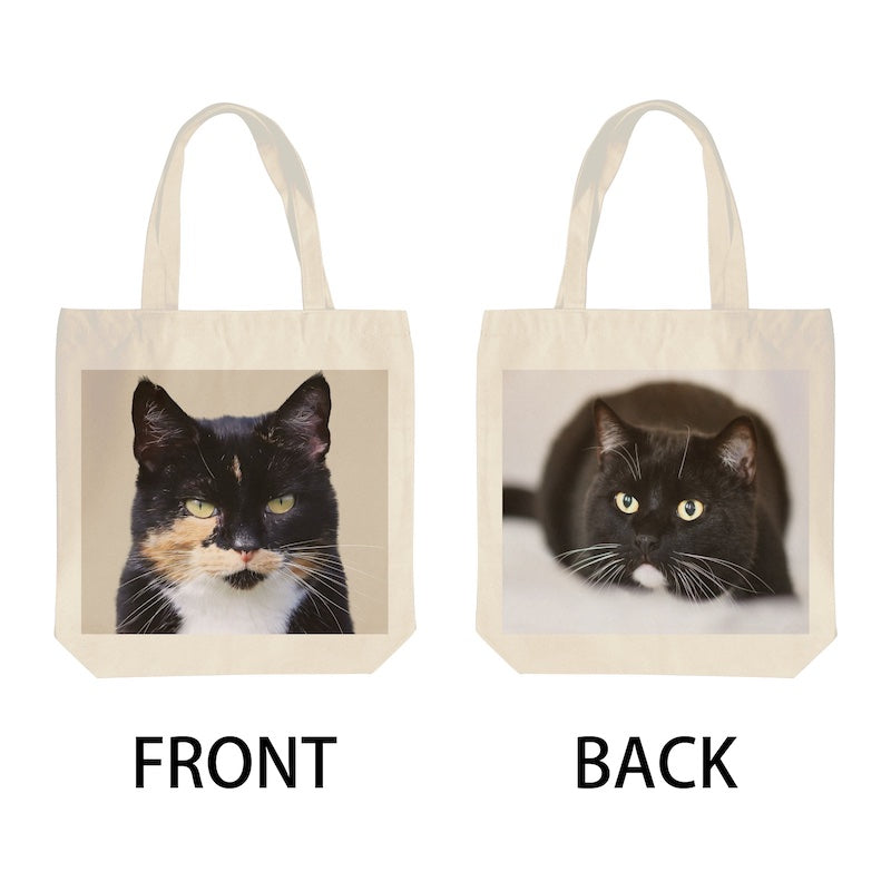 Tote bag with a cat's face on the front and back, showing both sides.