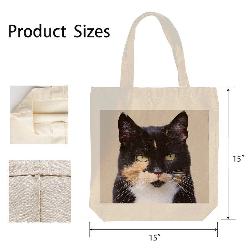 Tote bag with a cat design and measurements on a white background