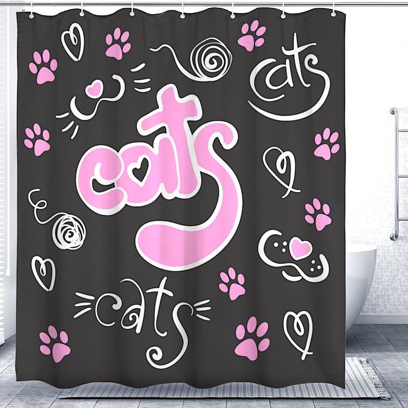 Black shower curtain with pink and white “cats” text and paw print design.