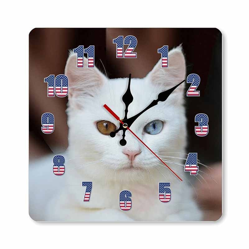 Wall clock with a cat's face design and American flag numbers