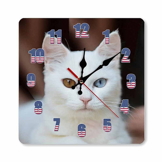 Wall clock with a cat's face design and American flag numbers