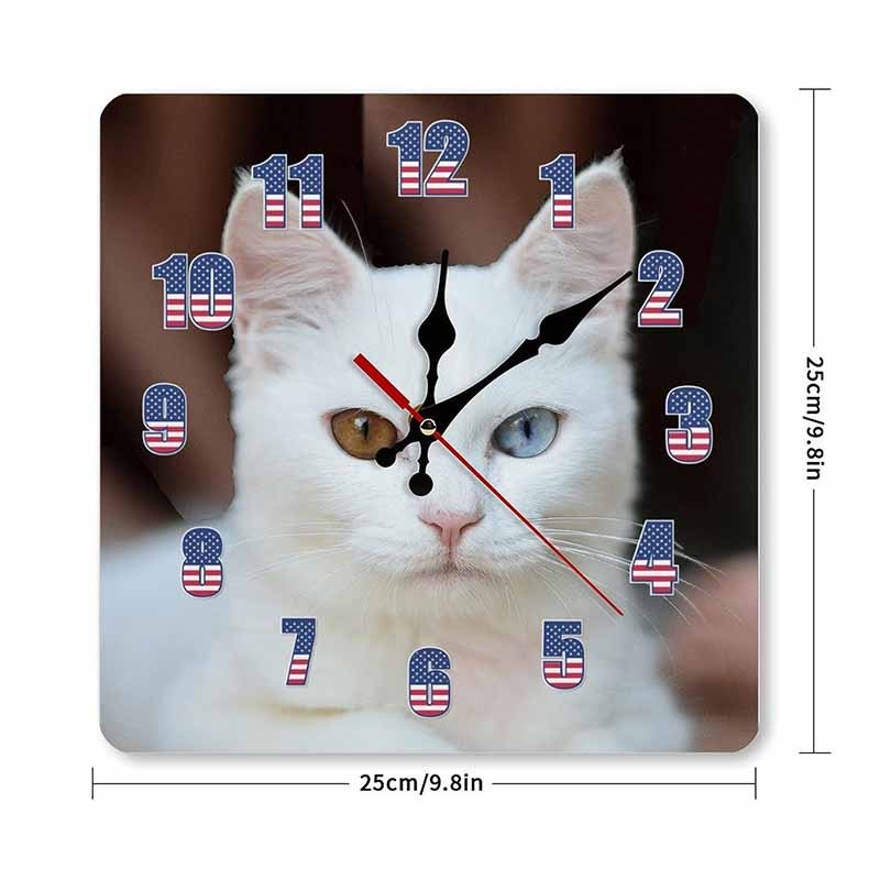 White cat wall clock with one blue eye and one amber eye, American flag numbers, and black and red hands.
